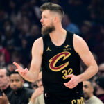 Feb 19, 2026; Cleveland, Ohio, USA; Cleveland Cavaliers forward Dean Wade (32) celebrates after hitting a three point basket against the Brooklyn Nets during the first quarter at Rocket Arena.