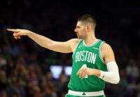 Feb 24, 2026; Phoenix, Arizona, USA; Boston Celtics center Nikola Vucevic (4) reacts against the Phoenix Suns in the first half at Mortgage Matchup Center.