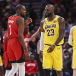 Mar 16, 2026; Houston, Texas, USA; Houston Rockets forward Kevin Durant (7) talks with Los Angeles Lakers forward LeBron James (23) on the court during the second quarter at Toyota Center.