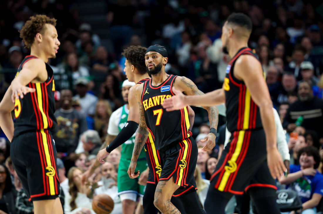 Mar 18, 2026; Dallas, Texas, USA; Atlanta Hawks guard Nickeil Alexander-Walker (7) celebrates with Atlanta Hawks guard CJ McCollum (3) and Atlanta Hawks guard Dyson Daniels (5) during the first half against the Dallas Mavericks at American Airlines Center. Mandatory Credit: