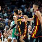Mar 18, 2026; Dallas, Texas, USA; Atlanta Hawks guard Nickeil Alexander-Walker (7) celebrates with Atlanta Hawks guard CJ McCollum (3) and Atlanta Hawks guard Dyson Daniels (5) during the first half against the Dallas Mavericks at American Airlines Center. Mandatory Credit:
