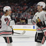 Mar 26, 2026; Philadelphia, Pennsylvania, USA; Chicago Blackhawks center Connor Bedard (98) celebrates his goal with center Ryan Greene (20) against the Philadelphia Flyers during the second period at Xfinity Mobile Arena. Mandatory Credit: Eric Hartline-Imagn Images