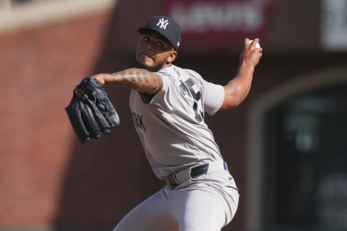 Mar 27, 2026; San Francisco, California, USA; New York Yankees pitcher Camilo Doval (75) throws a pitch against the San Francisco Giants during the eighth inning at Oracle Park. Mandatory Credit: Darren Yamashita-Imagn Images