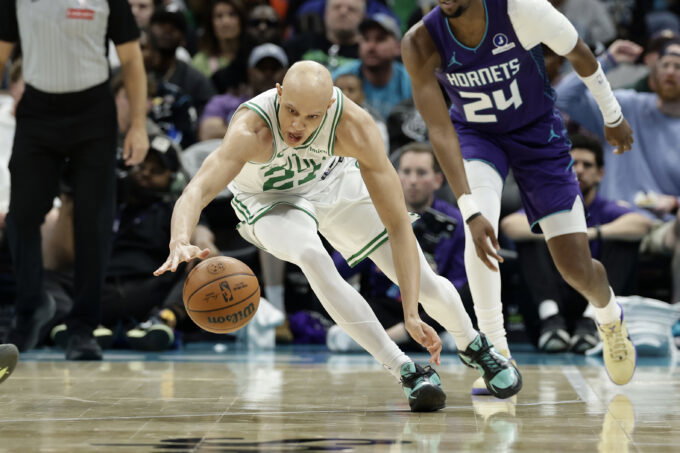 Mar 29, 2026; Charlotte, North Carolina, USA; Boston Celtics guard Jordan Walsh (27) dives after a loose ball during the second quarter against the Charlotte Hornets at Spectrum Center. Mandatory Credit: