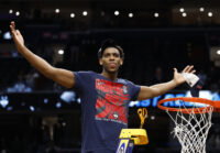 Mar 29, 2026; Washington, DC, USA; UConn Huskies forward Tarris Reed Jr. (5) cuts down the net after defeating the Duke Blue Devils in an Elite Eight game of the East Regional of the men's 2026 NCAA Tournament at Capital One Arena. Mandatory Credit: Geoff Burke-Imagn Images