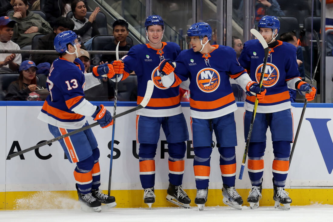 Mar 30, 2026; Elmont, New York, USA; New York Islanders center Brayden Schenn (10) celebrates his goal against the Pittsburgh Penguins with center Mathew Barzal (13) and center Calum Ritchie (64) and defenseman Carson Soucy (4) during the second period at UBS Arena. Mandatory Credit: Brad Penner-Imagn Images