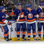 Mar 30, 2026; Elmont, New York, USA; New York Islanders center Brayden Schenn (10) celebrates his goal against the Pittsburgh Penguins with center Mathew Barzal (13) and center Calum Ritchie (64) and defenseman Carson Soucy (4) during the second period at UBS Arena. Mandatory Credit: Brad Penner-Imagn Images
