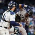 Mar 30, 2026; Seattle, Washington, USA; New York Yankees shortstop Jose Caballero (72) signals for an ABS challenge on a pitch by the Seattle Mariners during the third inning at T-Mobile Park. The strike was overturned and Caballero walked. Mandatory Credit: Joe Nicholson-Imagn Images