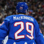 Apr 1, 2026; Denver, Colorado, USA; Colorado Avalanche center Nathan MacKinnon (29) during the second period against the Vancouver Canucks at Ball Arena. Mandatory Credit: Ron Chenoy-Imagn Images