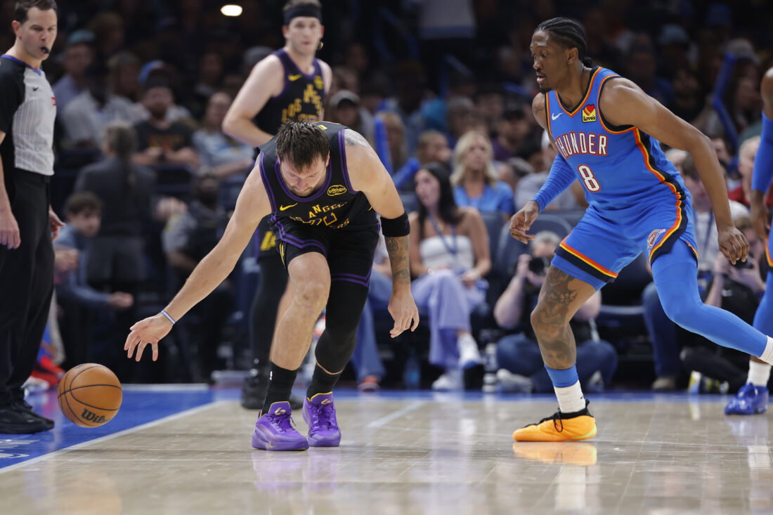 Apr 2, 2026; Oklahoma City, Oklahoma, USA; Los Angeles Lakers guard Luka Doncic (77) looses the ball during a drive against Oklahoma City Thunder guard Jalen Williams (8) during the second half at Paycom Center. Mandatory Credit: Alonzo Adams-Imagn Images