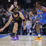 Apr 2, 2026; Oklahoma City, Oklahoma, USA; Los Angeles Lakers guard Luka Doncic (77) looses the ball during a drive against Oklahoma City Thunder guard Jalen Williams (8) during the second half at Paycom Center. Mandatory Credit: Alonzo Adams-Imagn Images