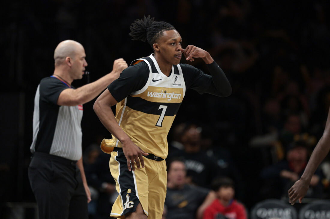 Apr 5, 2026; Brooklyn, New York, USA; Washington Wizards guard Bub Carrington (7) reacts after making a three point basket during the second half against the Brooklyn Nets at Barclays Center. Mandatory Credit:
