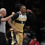 Apr 5, 2026; Brooklyn, New York, USA; Washington Wizards guard Bub Carrington (7) reacts after making a three point basket during the second half against the Brooklyn Nets at Barclays Center. Mandatory Credit: