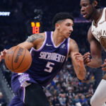 Apr 7, 2026; San Francisco, California, USA; Sacramento Kings guard Nique Clifford (5) drives to the basket against Golden State Warriors forward/center Charles Bassey (28) in the second quarter at Chase Center. Mandatory Credit: David Gonzales-Imagn Images