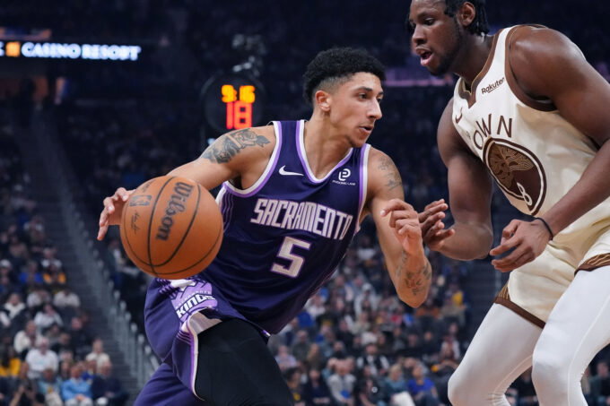 Apr 7, 2026; San Francisco, California, USA; Sacramento Kings guard Nique Clifford (5) drives to the basket against Golden State Warriors forward/center Charles Bassey (28) in the second quarter at Chase Center. Mandatory Credit: David Gonzales-Imagn Images