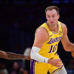 April 7, 2026; Los Angeles, California, USA; Los Angeles Lakers guard Luke Kennard (10) moves the ball against the Oklahoma City Thunder during the first half at Crypto.com Arena. Mandatory Credit: Gary A. Vasquez-Imagn Images
