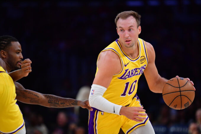 April 7, 2026; Los Angeles, California, USA; Los Angeles Lakers guard Luke Kennard (10) moves the ball against the Oklahoma City Thunder during the first half at Crypto.com Arena. Mandatory Credit: Gary A. Vasquez-Imagn Images