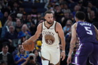 Apr 7, 2026; San Francisco, California, USA; Golden State Warriors guard Stephen Curry (30) dribbles upcourt while defended by Sacramento Kings guard Nique Clifford (5) in the fourth quarter at Chase Center.