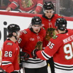 Apr 9, 2026; Chicago, Illinois, USA; Chicago Blackhawks center Anton Frondell (16) celebrates his goal against the Carolina Hurricanes with teammates during the third period at the United Center. Mandatory Credit: Matt Marton-Imagn Images
