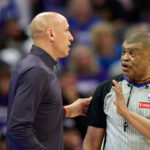 Apr 10, 2026; Sacramento, California, USA; Sacramento Kings head coach Doug Christie talks with referee Tony Brothers (25) during the first half against the against the Golden State Warriors at Golden 1 Center. Mandatory Credit: Robert Edwards-Imagn Images