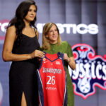 Apr 13, 2026; New York, NY, USA; WNBA Commissioner Cathy Engelbert (right) poses for photos with Lauren Betts who was selected fourth overall by the Washington Mystics during the 2026 WNBA Draft at The Shed at Hudson Yards.
