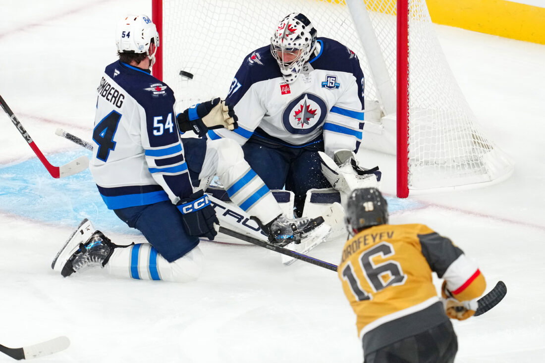 Apr 13, 2026; Las Vegas, Nevada, USA; Vegas Golden Knights right wing Pavel Dorofeyev (16) scores a goal against Winnipeg Jets goaltender Connor Hellebuyck (37) during the third period at T-Mobile Arena. Mandatory Credit: