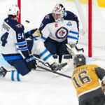 Apr 13, 2026; Las Vegas, Nevada, USA; Vegas Golden Knights right wing Pavel Dorofeyev (16) scores a goal against Winnipeg Jets goaltender Connor Hellebuyck (37) during the third period at T-Mobile Arena. Mandatory Credit: