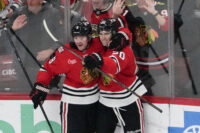 Apr 15, 2026; Chicago, Illinois, USA; Chicago Blackhawks center Ryan Greene (20) celebrates his goal against the San Jose Sharks with center Ryan Donato (8) during the third period at United Center. Mandatory Credit: