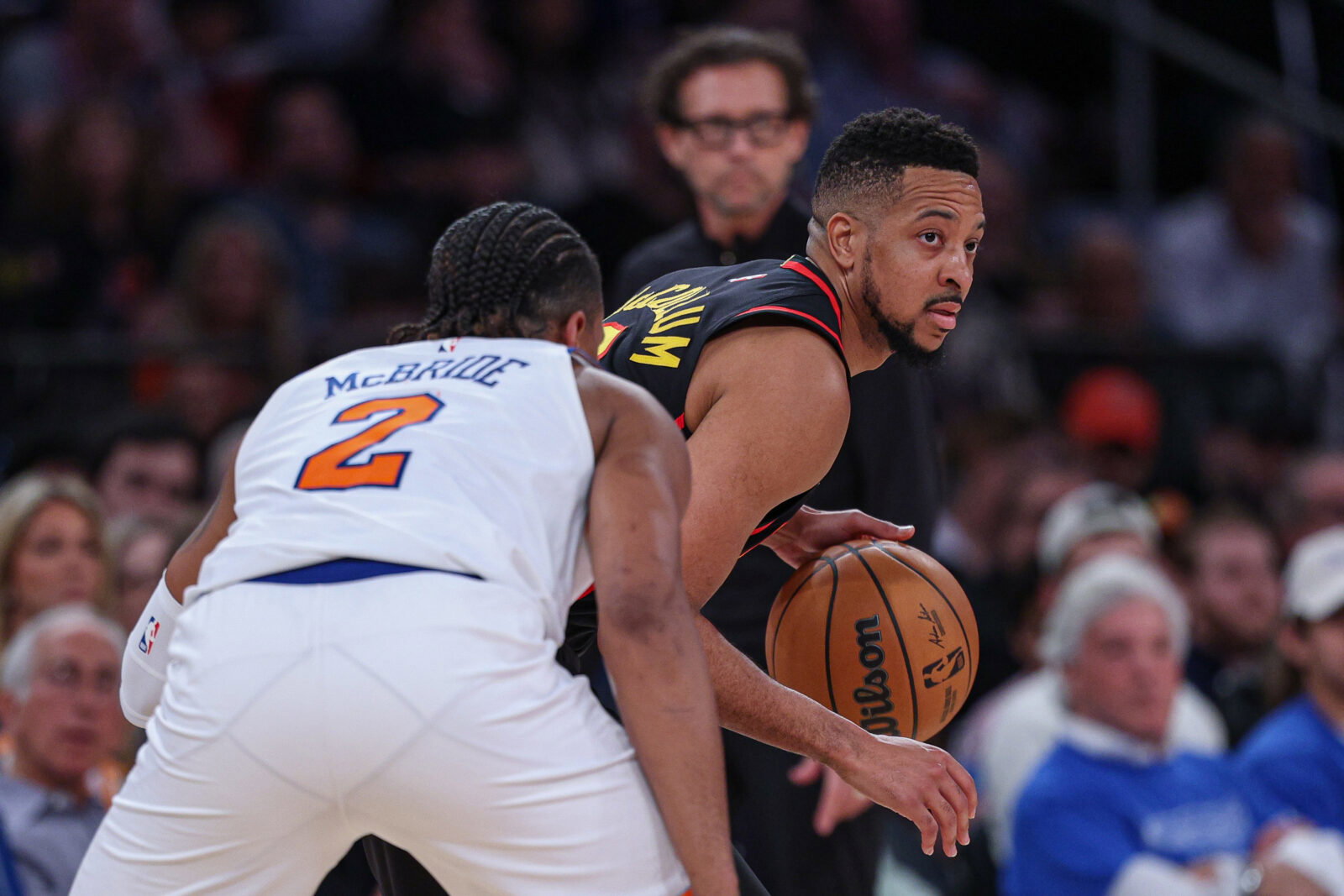 Apr 18, 2026; New York, New York, USA; Atlanta Hawks guard CJ McCollum (3) is guarded by New York Knicks guard Miles McBride (2) during the second half of the 2026 NBA Playoffs at Madison Square Garden. Mandatory Credit: Vincent Carchietta-Imagn Images