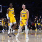 Apr 18, 2026; Los Angeles, California, USA; Los Angeles Lakers guard Luke Kennard (10) and center Deandre Ayton (5) celebrate against the Houston Rockets in the second half during game one of the first round of the 2026 NBA Playoffs at Crypto.com Arena. Mandatory Credit: Kirby Lee-Imagn Images