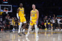 Apr 18, 2026; Los Angeles, California, USA; Los Angeles Lakers guard Luke Kennard (10) and center Deandre Ayton (5) celebrate against the Houston Rockets in the second half during game one of the first round of the 2026 NBA Playoffs at Crypto.com Arena. Mandatory Credit: Kirby Lee-Imagn Images