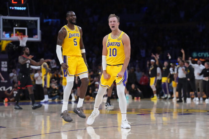 Apr 18, 2026; Los Angeles, California, USA; Los Angeles Lakers guard Luke Kennard (10) and center Deandre Ayton (5) celebrate against the Houston Rockets in the second half during game one of the first round of the 2026 NBA Playoffs at Crypto.com Arena. Mandatory Credit: Kirby Lee-Imagn Images