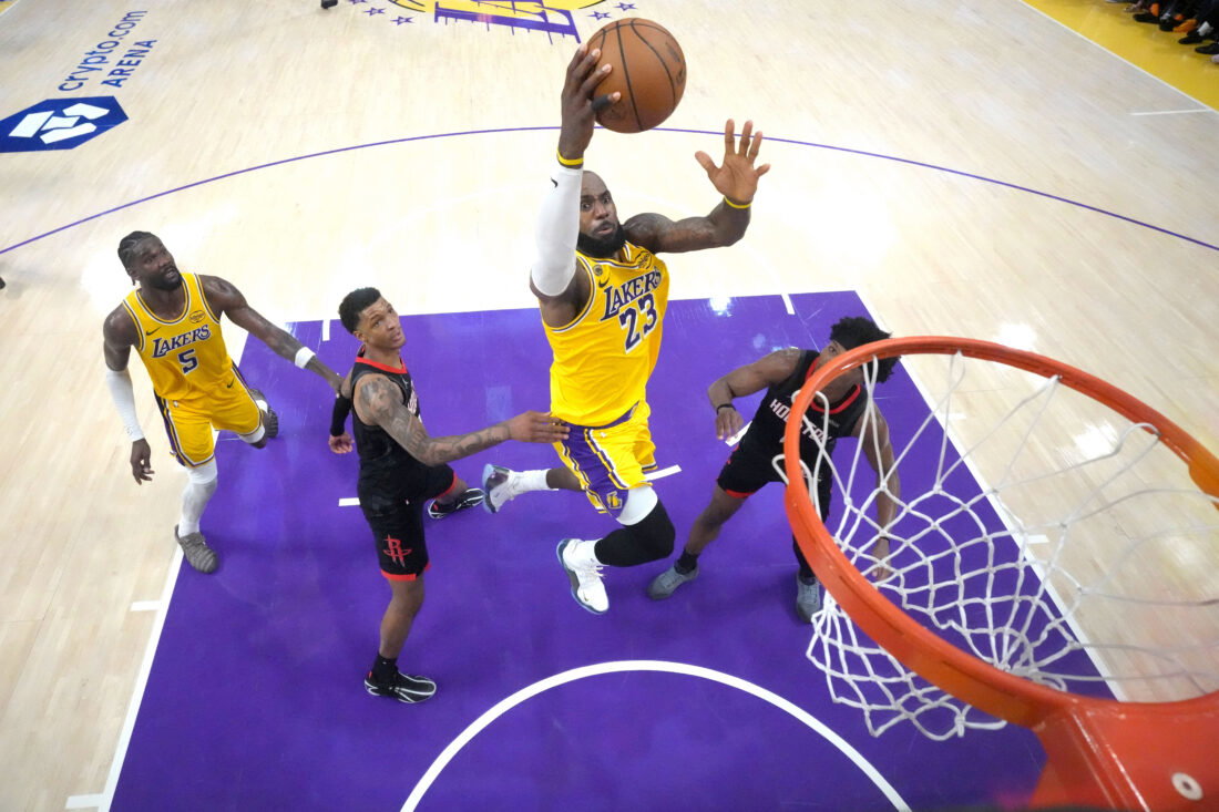 Apr 18, 2026; Los Angeles, California, USA; Los Angeles Lakers forward LeBron James (23) shoots the ball against Houston Rockets forward Jabari Smith Jr. (10) and guard Amen Thompson (1) in the second half during game one of the first round of the 2026 NBA Playoffs at Crypto.com Arena. Mandatory Credit: Kirby Lee-Imagn Images