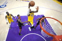Apr 18, 2026; Los Angeles, California, USA; Los Angeles Lakers forward LeBron James (23) shoots the ball against Houston Rockets forward Jabari Smith Jr. (10) and guard Amen Thompson (1) in the second half during game one of the first round of the 2026 NBA Playoffs at Crypto.com Arena. Mandatory Credit: Kirby Lee-Imagn Images