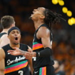 Apr 19, 2026; San Antonio, Texas, USA; San Antonio Spurs guard Devin Vassell (24) reacts after scoring a three-point basket during the second half of game one of the first round of the 2026 NBA Playoffs against the Portland Trail Blazers at Frost Bank Center. Mandatory Credit: Scott Wachter-Imagn Images