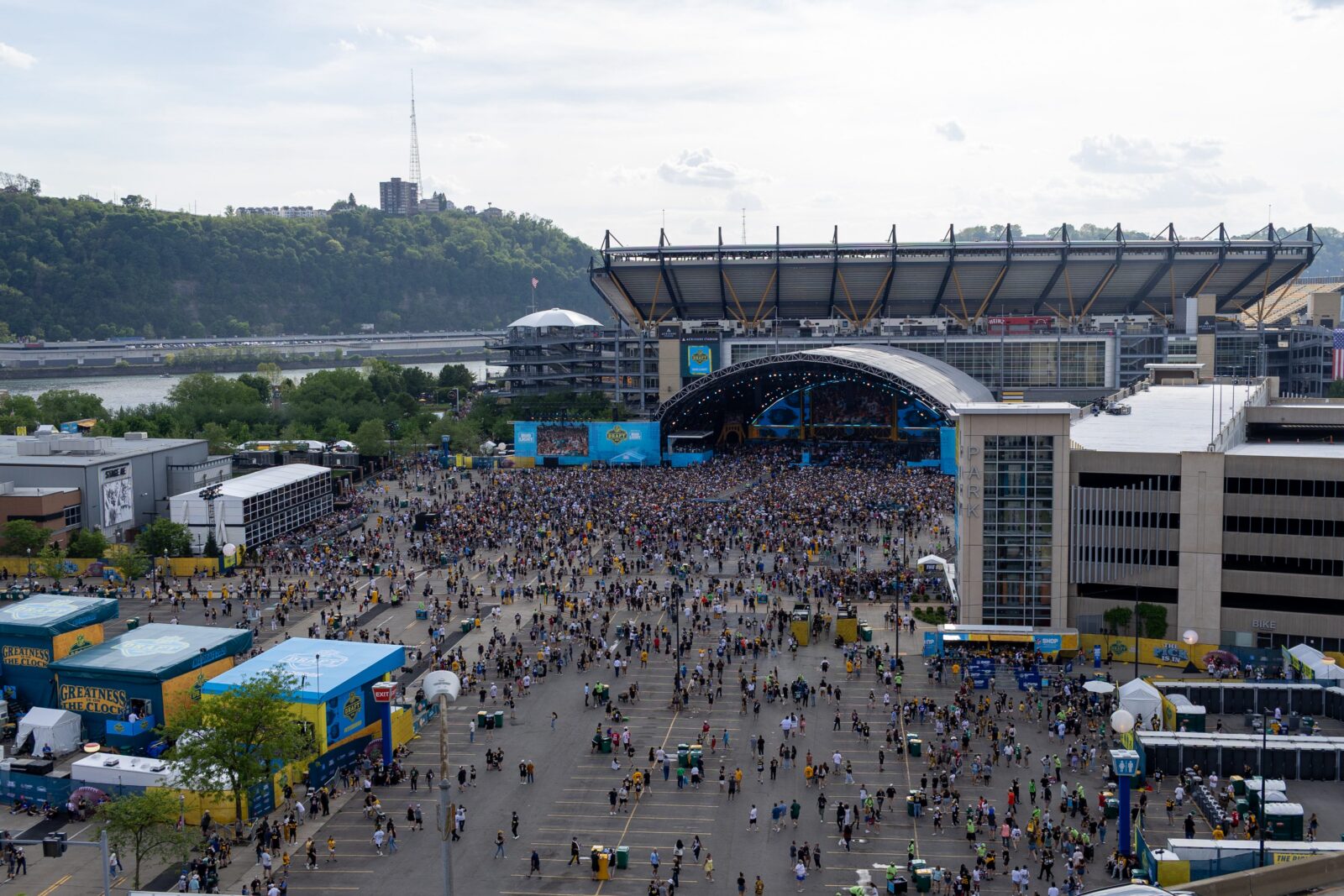 Fans begin to file into the standing room section of the NFL Draft Theater ahead of Night 2 of the 2026 NFL Draft outside Acrisure Stadium, Friday, April 24, 2026 in Pittsburgh, Pa.