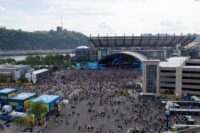 Fans begin to file into the standing room section of the NFL Draft Theater ahead of Night 2 of the 2026 NFL Draft outside Acrisure Stadium, Friday, April 24, 2026 in Pittsburgh, Pa.