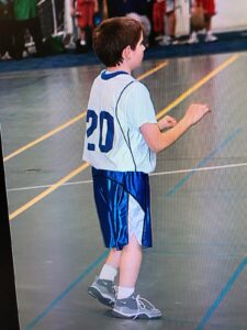 Sheldon Wohlman playing youth basketball in Minnesota.