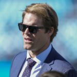 Nov 19, 2023; Charlotte, North Carolina, USA; Former Panther and now announcer Greg Olsen during pregame warm ups between the Carolina Panthers and the Dallas Cowboys at Bank of America Stadium. Mandatory Credit: Jim Dedmon-USA TODAY Sports