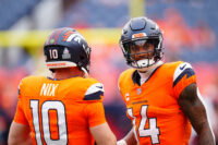 Oct 27, 2024; Denver, Colorado, USA; Denver Broncos quarterback Bo Nix (10) and wide receiver Courtland Sutton (14) before the game against the Carolina Panthers at Empower Field at Mile High. Mandatory Credit: Ron Chenoy-Imagn Images