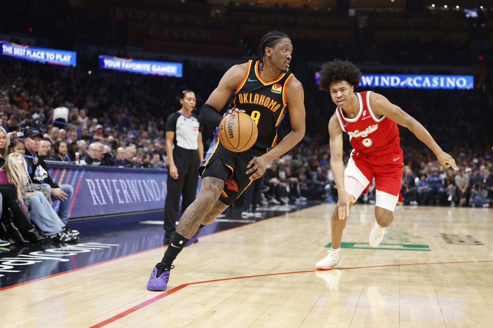 Dec 29, 2024; Oklahoma City, Oklahoma, USA; Oklahoma City Thunder forward Jalen Williams (8) drives around Memphis Grizzlies forward Jaylen Wells (0) during the second quarter at Paycom Center.
