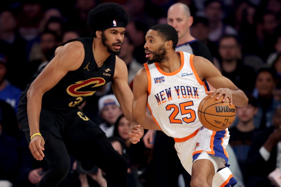 Apr 11, 2025; New York, New York, USA; New York Knicks forward Mikal Bridges (25) drives to the basket against Cleveland Cavaliers center Jarrett Allen (31) during the first quarter at Madison Square Garden. Mandatory Credit: