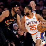 Apr 11, 2025; New York, New York, USA; New York Knicks forward Mikal Bridges (25) drives to the basket against Cleveland Cavaliers center Jarrett Allen (31) during the first quarter at Madison Square Garden. Mandatory Credit: