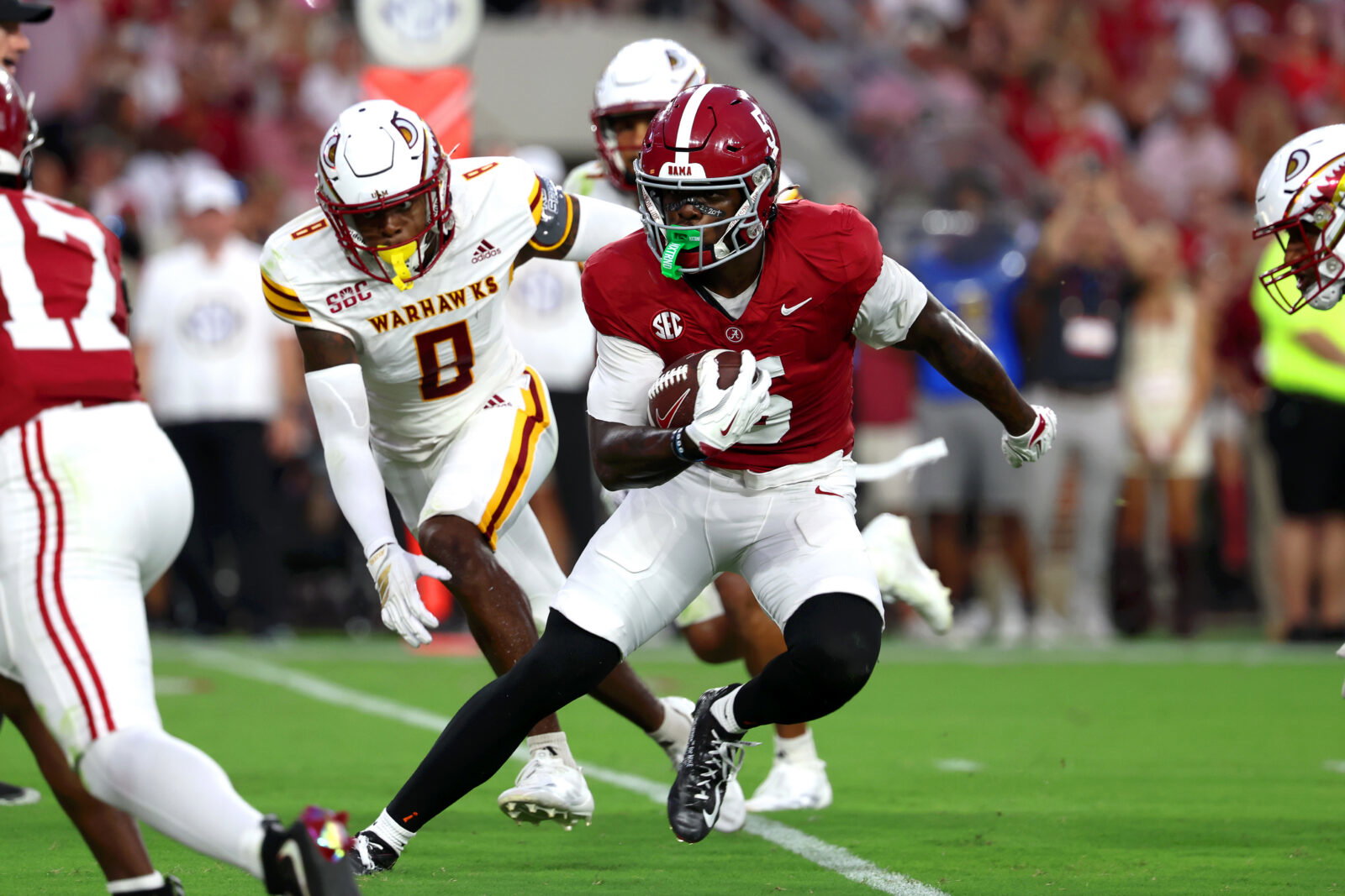 Sep 6, 2025; Tuscaloosa, Alabama, USA; Alabama Crimson Tide wide receiver Germie Bernard (5) carries the ball during the first quarter against the Louisiana Monroe Warhawks at Saban Field at Bryant-Denny Stadium. Mandatory Credit: David Leong-Imagn Images