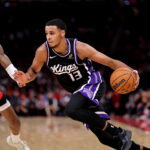 Dec 3, 2025; Houston, Texas, USA; Sacramento Kings forward Keegan Murray (13) drives to the basket against Houston Rockets forward Jabari Smith Jr. (10) during the third quarter at Toyota Center. Mandatory Credit: Erik Williams-Imagn Images