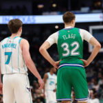 Jan 29, 2026; Dallas, Texas, USA; Charlotte Hornets guard Kon Knueppel (7) stands with Dallas Mavericks forward Cooper Flagg (32) during the second half at American Airlines Center. Mandatory Credit: Kevin Jairaj-Imagn Images