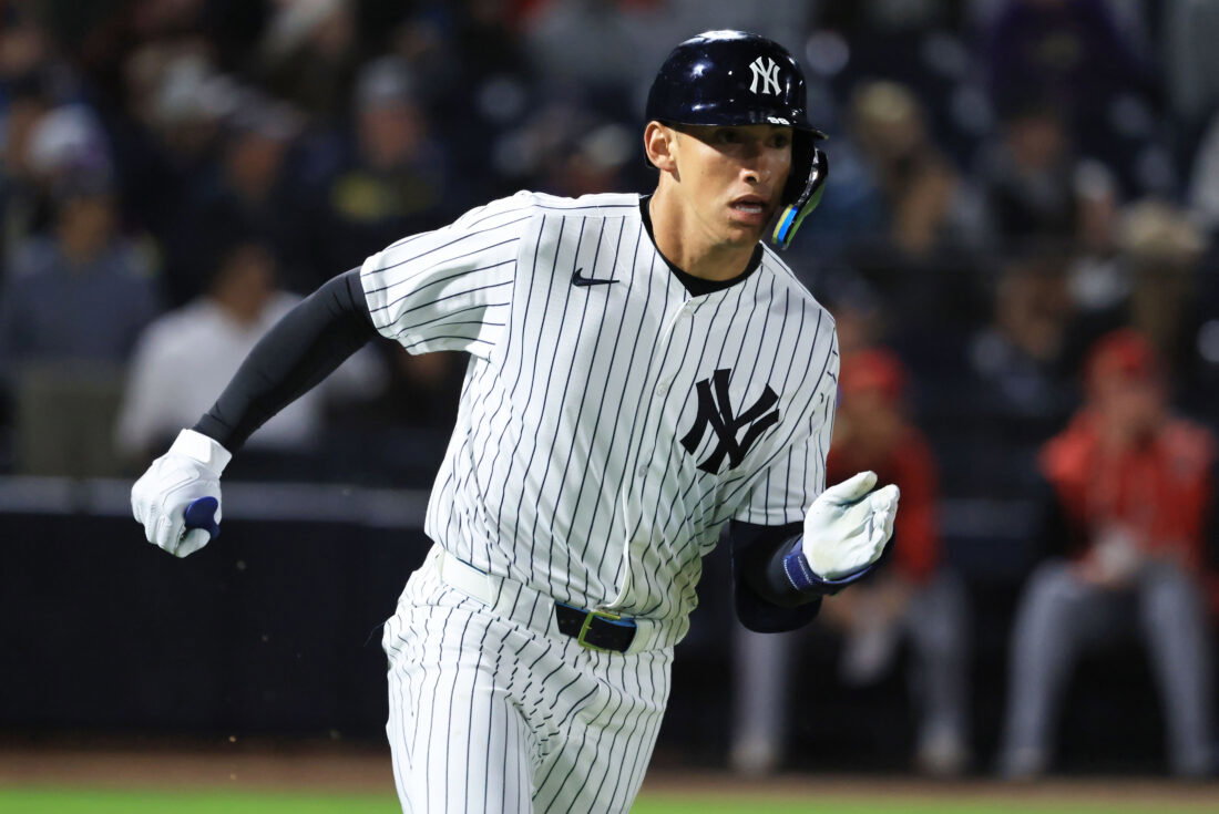 Feb 25, 2026; Tampa, Florida, USA; New York Yankees infielder George Lombard Jr (96) hits a two-RBI double during the fifth inning against the Washington Nationals at George M. Steinbrenner Field.