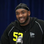 Feb 25, 2026; Indianapolis, IN, USA; Michigan defensive lineman Derrick Moore (DL52) speaks during the NFL Scouting Combine at the Indiana Convention Center. Mandatory Credit: Kirby Lee-Imagn Images