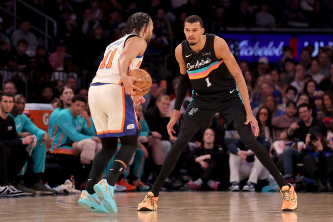 Mar 1, 2026; New York, New York, USA; San Antonio Spurs forward Victor Wembanyama (1) defends New York Knicks guard Jalen Brunson (11) during the third quarter at Madison Square Garden. Mandatory Credit: Brad Penner-Imagn Images