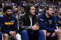Mar 1, 2026; Denver, Colorado, USA; Denver Nuggets guard Jamal Murray (27) and forward Aaron Gordon (32) and center Nikola Jokic (15) on the bench during the second quarter against the Minnesota Timberwolves at Ball Arena. Mandatory Credit: Ron Chenoy-Imagn Images